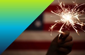 American flag and sparkler from a fourth of july celebration