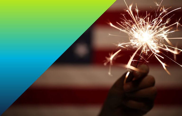 American flag and sparkler from a fourth of july celebration